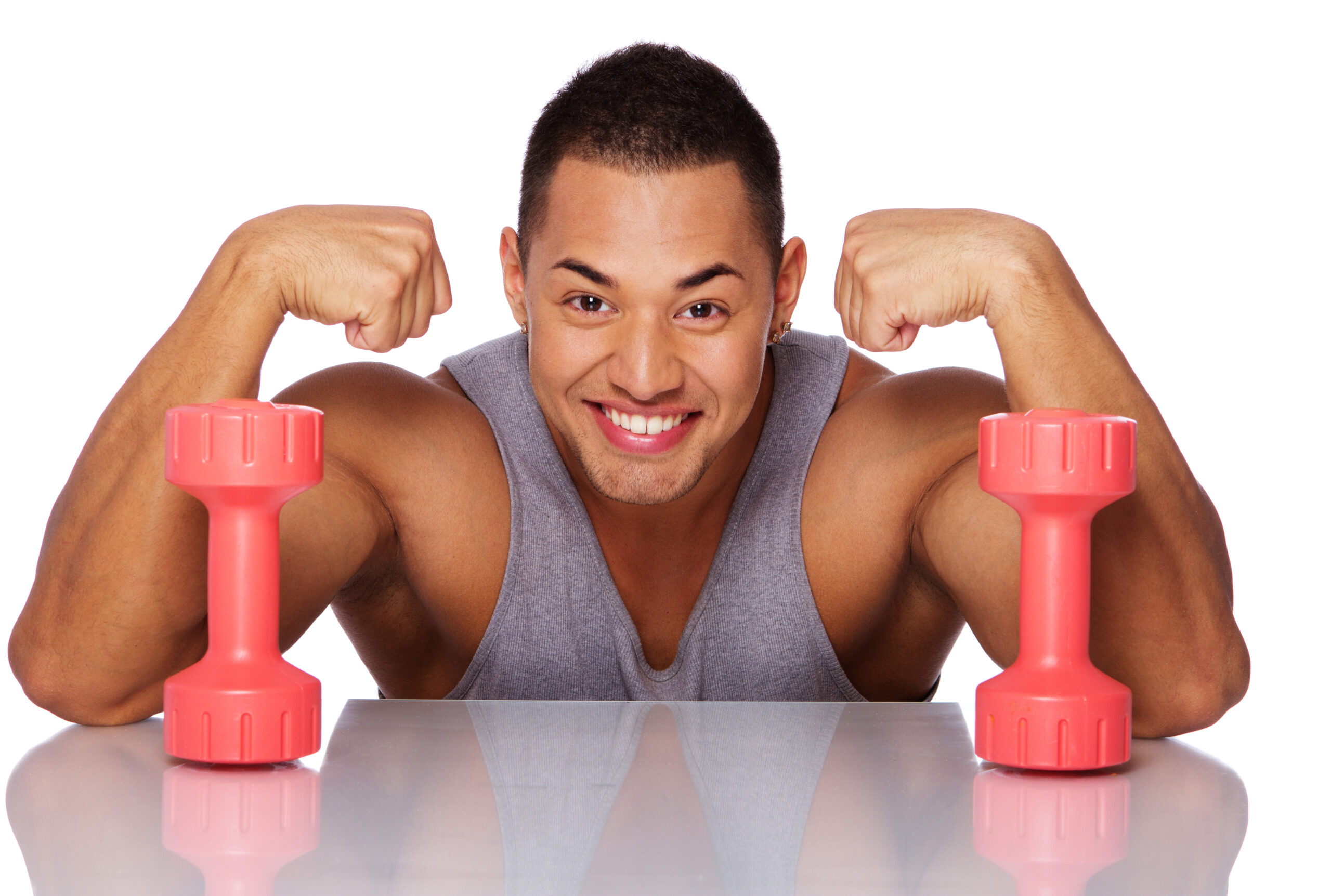 portrait handsome man posing studio with dumbbels scaled