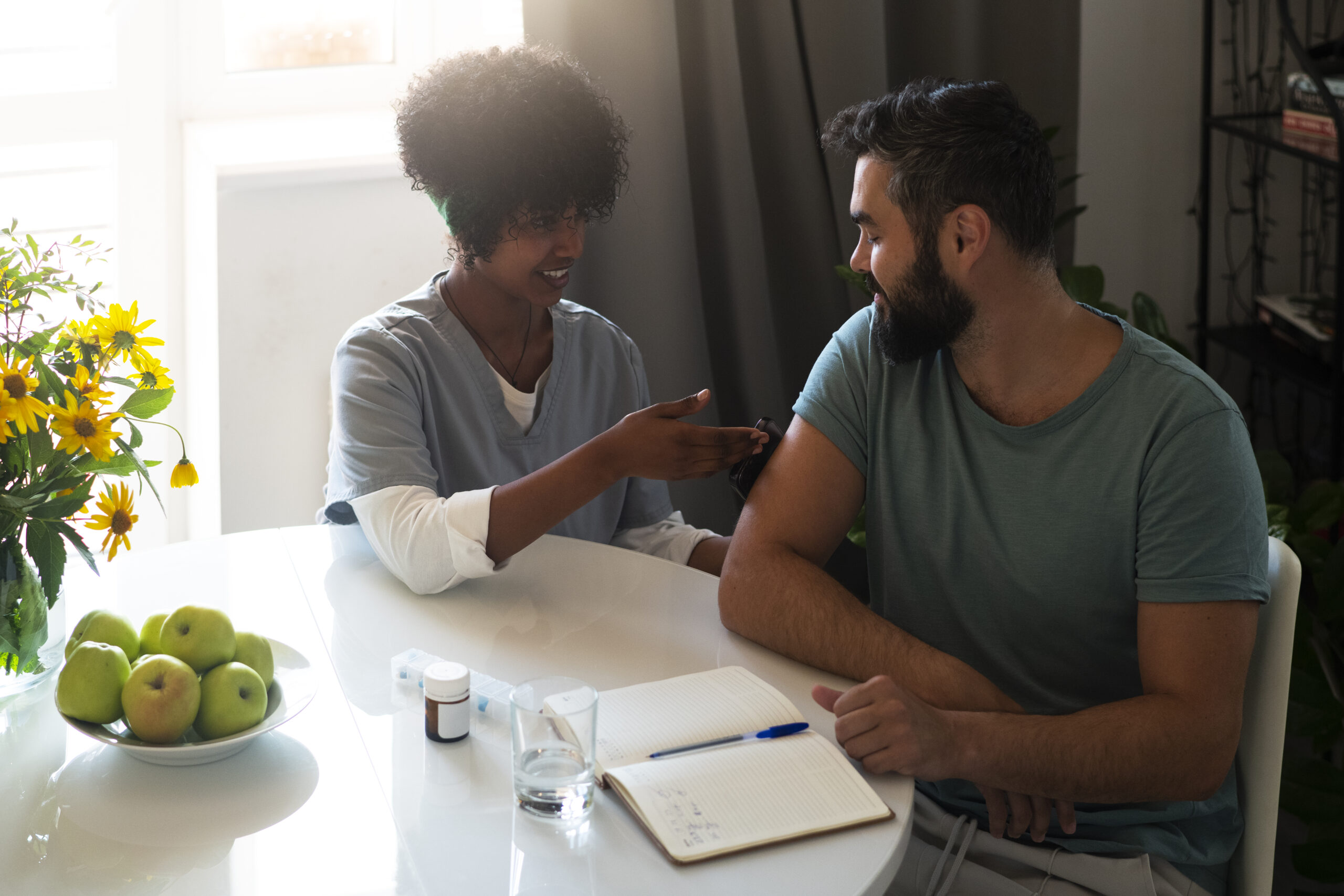 close up nurse helping diabetic person checking their glucose levels scaled