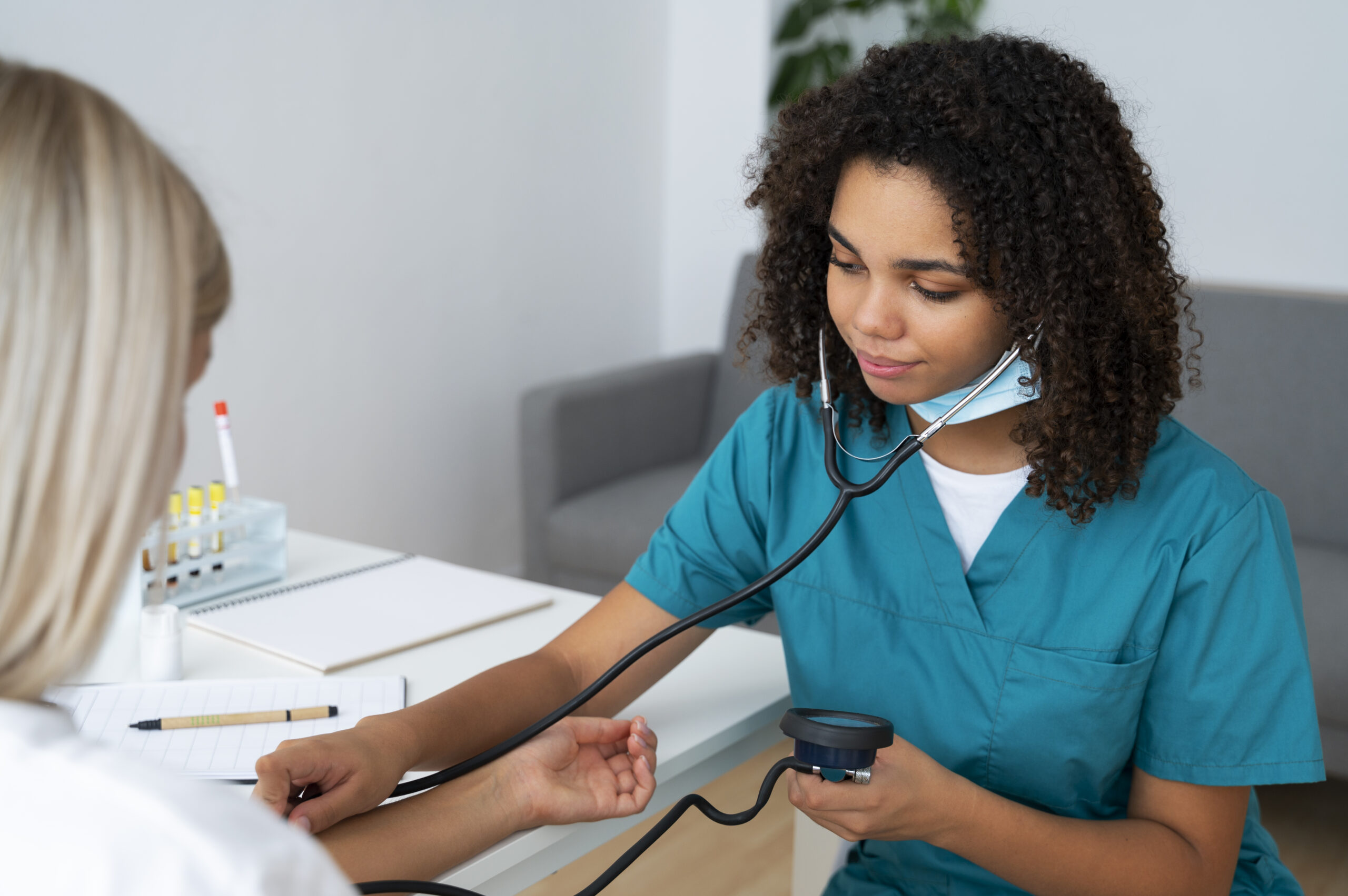 female nurse practicing medicine clinic scaled