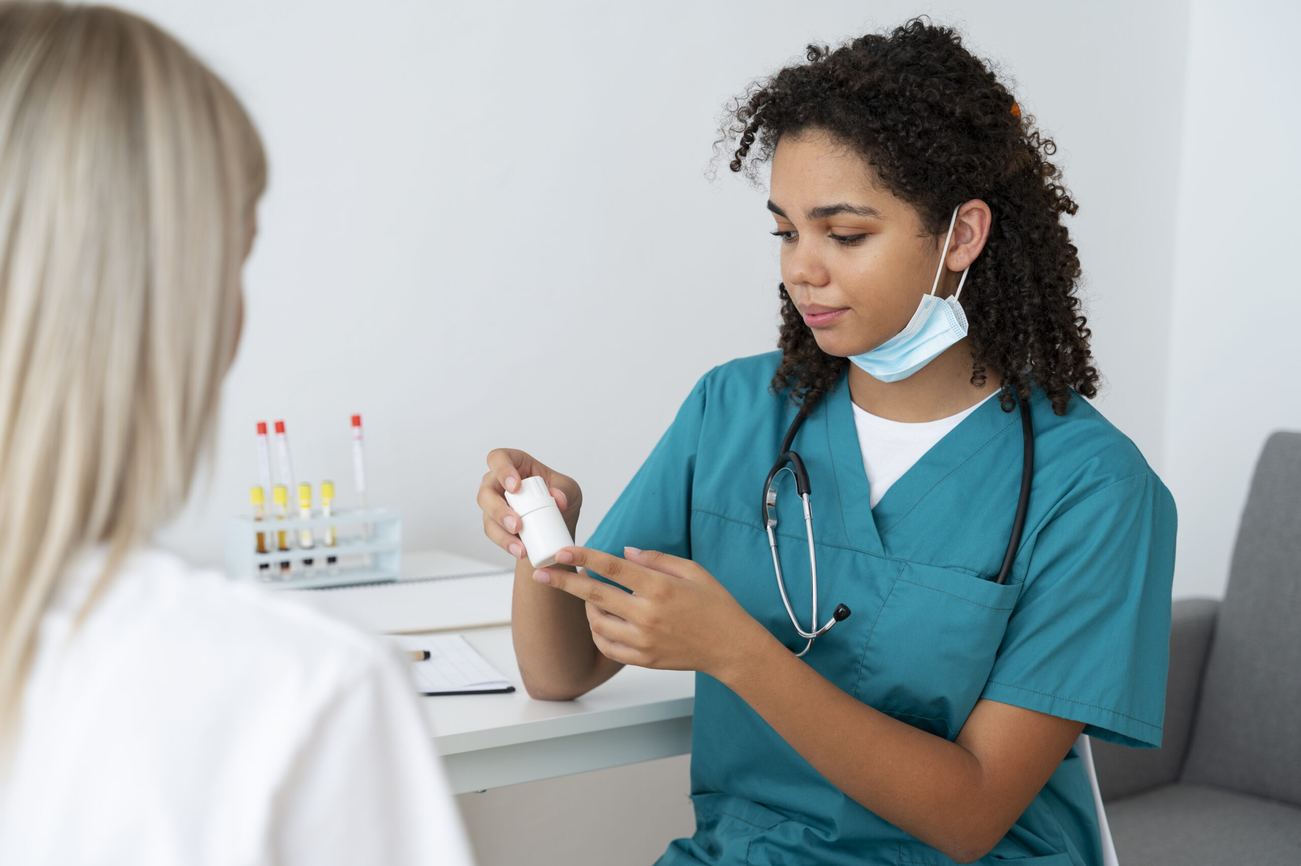 female nurse practicing medicine clinic scaled