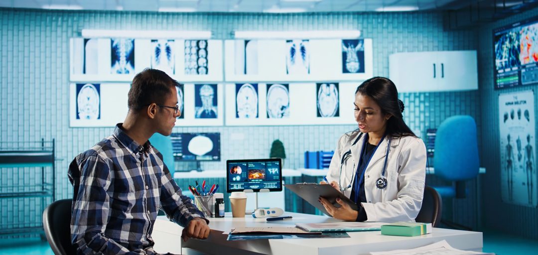 General practitioner consulting patient and reviewing x ray test results, utilizing technology for analysis and care management in a medical environment. Healthcare provider. Camera B.